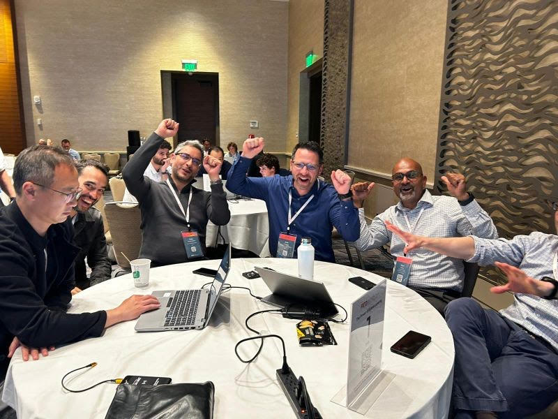 Team celebrating after participating in the FICO Score 10 T Simulation Challenge